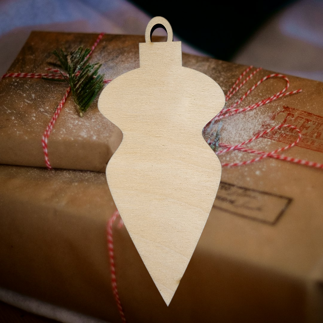An elegant, teardrop-shaped finial wood cutout for DIY Christmas ornaments.