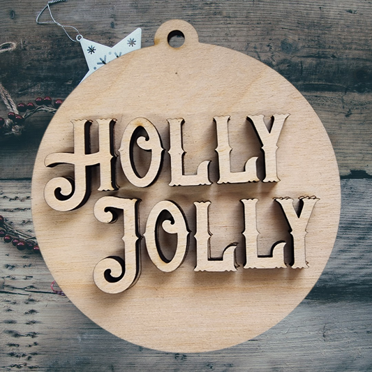 A layered "Holly Jolly" wood craft kit shown assembled on a rustic wood background with holiday decor.