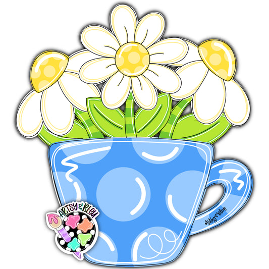 Blue teacup with daisies on a white background
