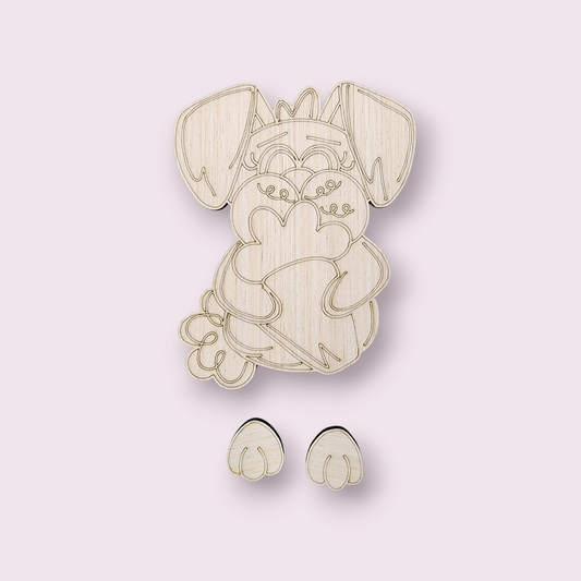 Unfinished wood craft kit of a cute bunny holding a heart with two separate paw pieces shown below.