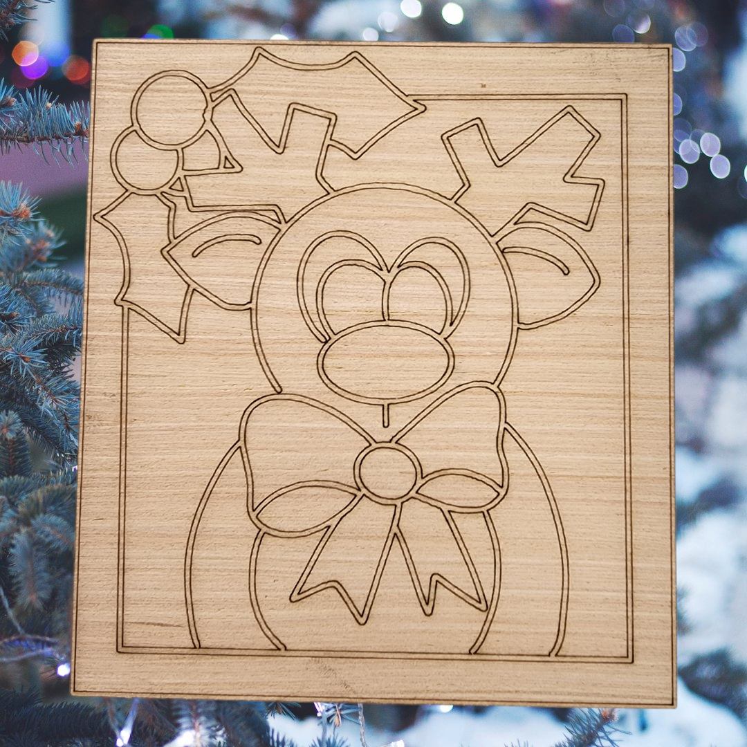 Unfinished square wood blank with an engraved design of a cute reindeer with a bow tie and holly.